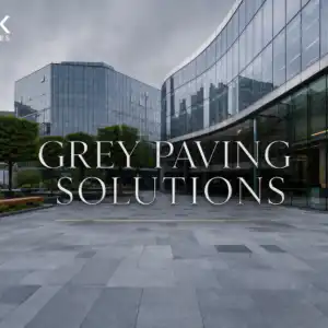 A modern UK commercial plaza showcasing premium grey paving solutions including silver granite and grey porcelain.